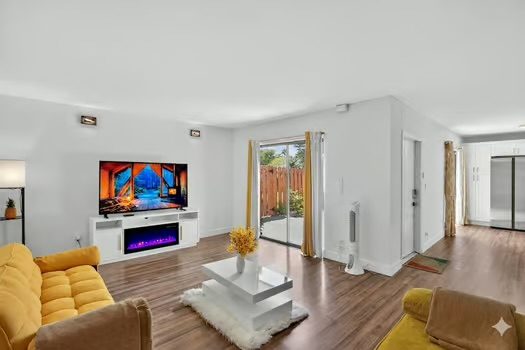 Living room: Smart TV and electric fireplace - FL "Pet Friendly Townhome | 2BR, 2.5-Bath Near Sanibel"